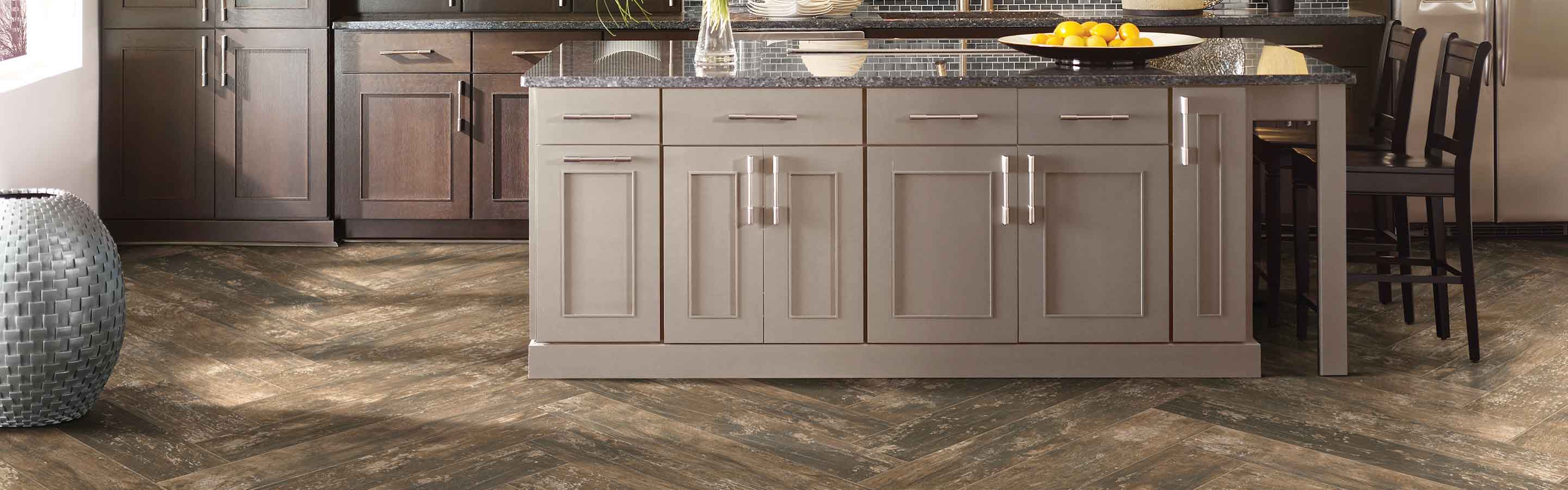 wood-look tile in a kitchen with dark cabinetry